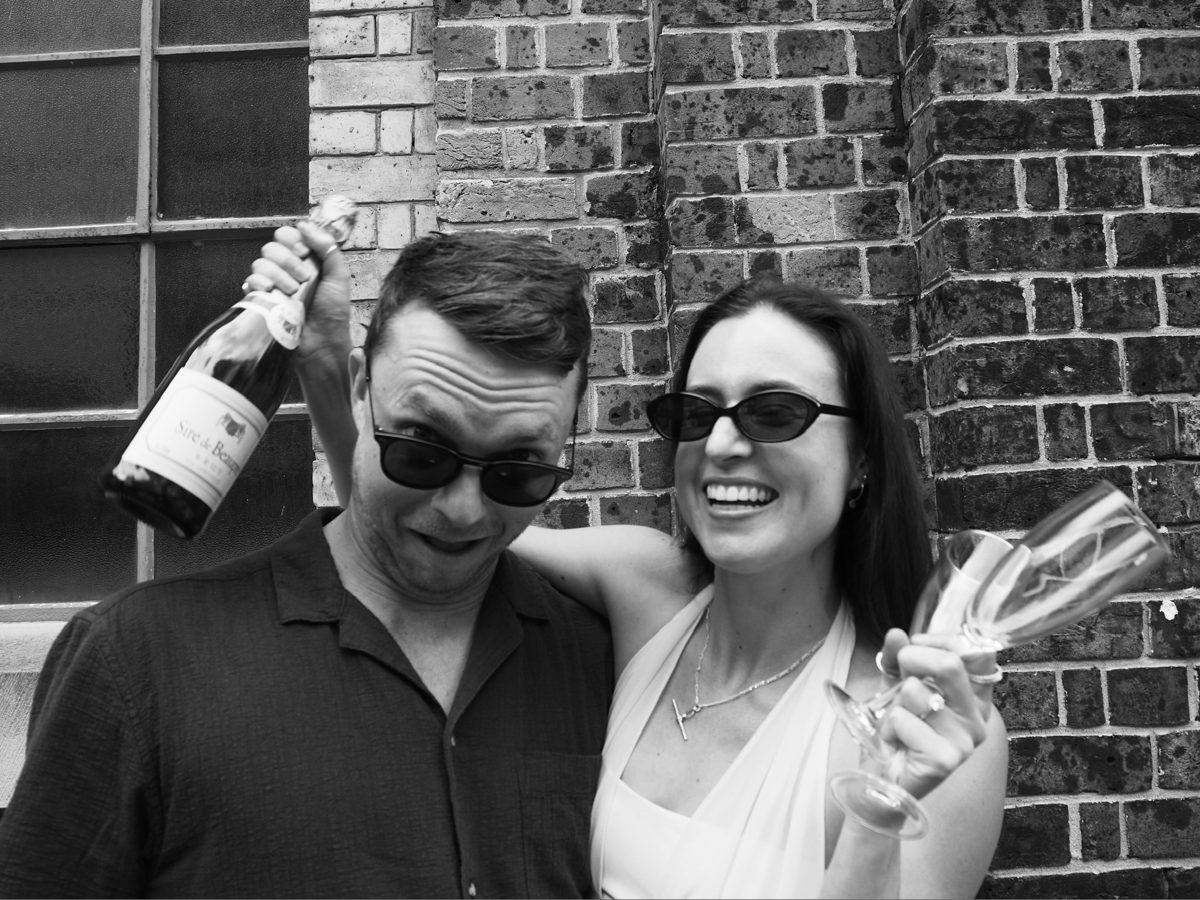 Steve and Tara celebrating with champagne
